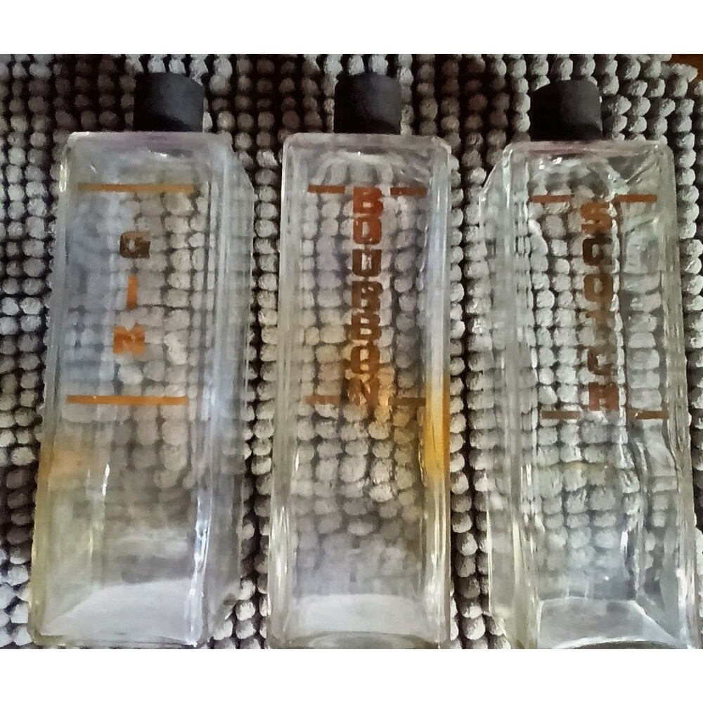 3 vintage liquor bottles
